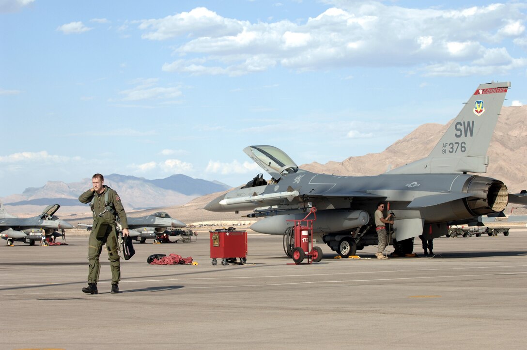Capt. Taylor Blevins walks away from his a F-16CJ Wild Weasel after completing a training mission July 16 at Red Flag 09-4 at Nellis Air Force Base, Nev. Red Flag is a highly-realistic combat training exercise. Captain Blevins is assigned to the 77th Fighter Squadron.  (U.S. Air Force photo/Tech. Sgt. Michael R. Holzworth)

