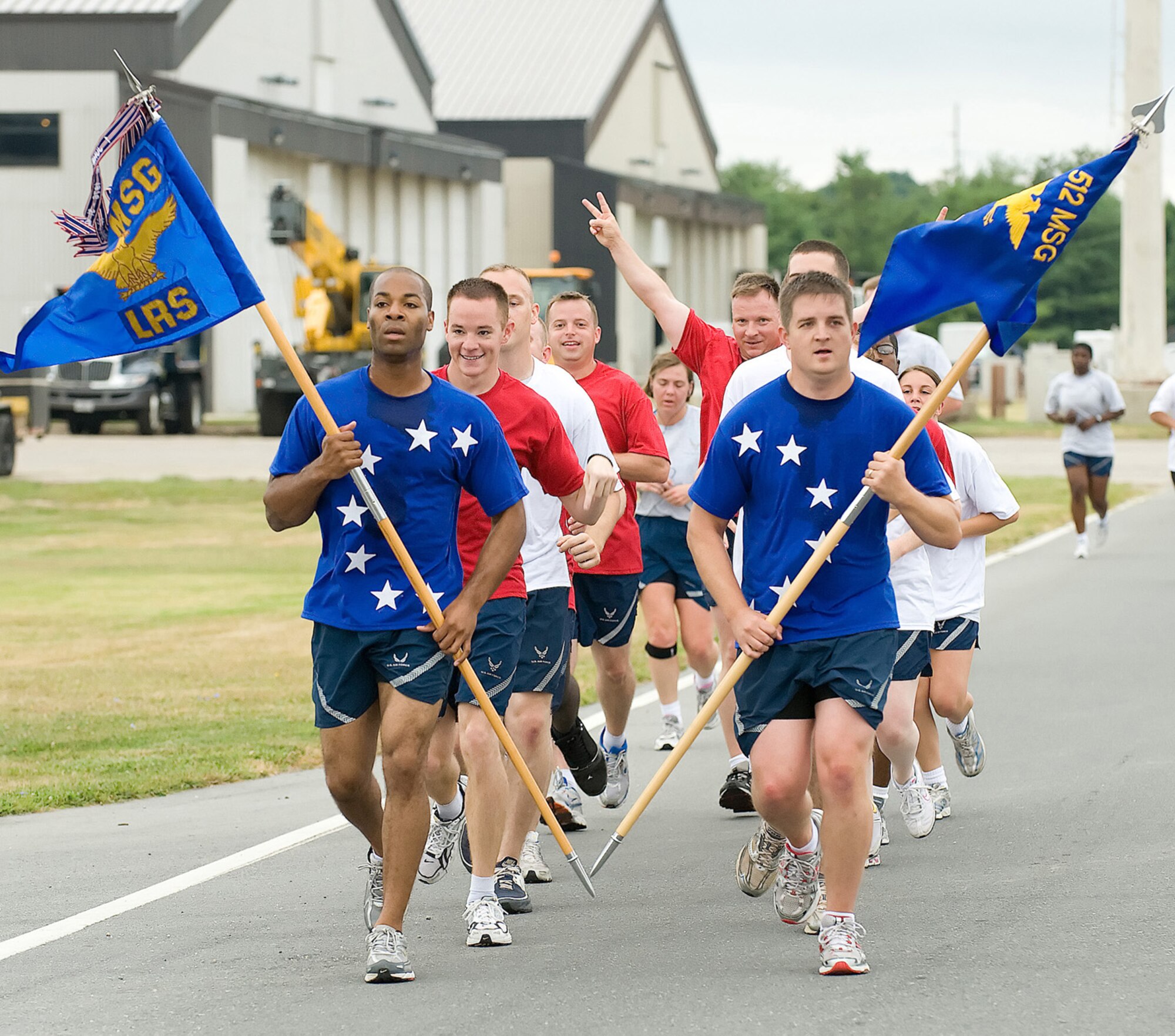 The 512th Logistics Readiness Flight and the 436th Logistics Readiness Squadron Airmen run in formation during the warrior run July 21 at Dover Air Force Base, Del. (U.S. Air Force photo/Jason Minto)