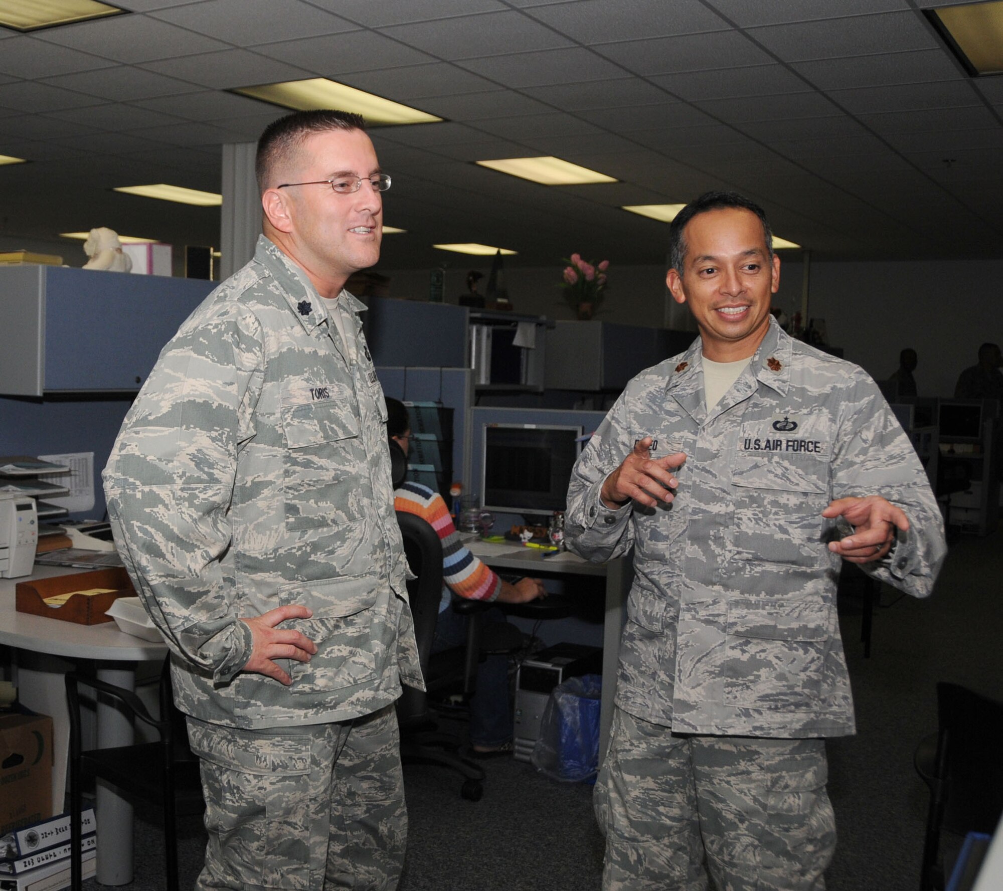 Lt. Col. Randolph Toris, left, new commander of the 81st Comptroller Squadron, tours the finance office with Maj. Robert Paleo, July 16. Colonel Toris, who took command from Major Paleo Friday, was previously the commander of the 27th Special Operations Comptroller Squadron, Cannon Air Force Base, N.M.  Major Paleo remains at Keesler as chief of the 81st Training Wing’s exercise and evaluation team.  (U.S. Air Force photo by Kemberly Groue)