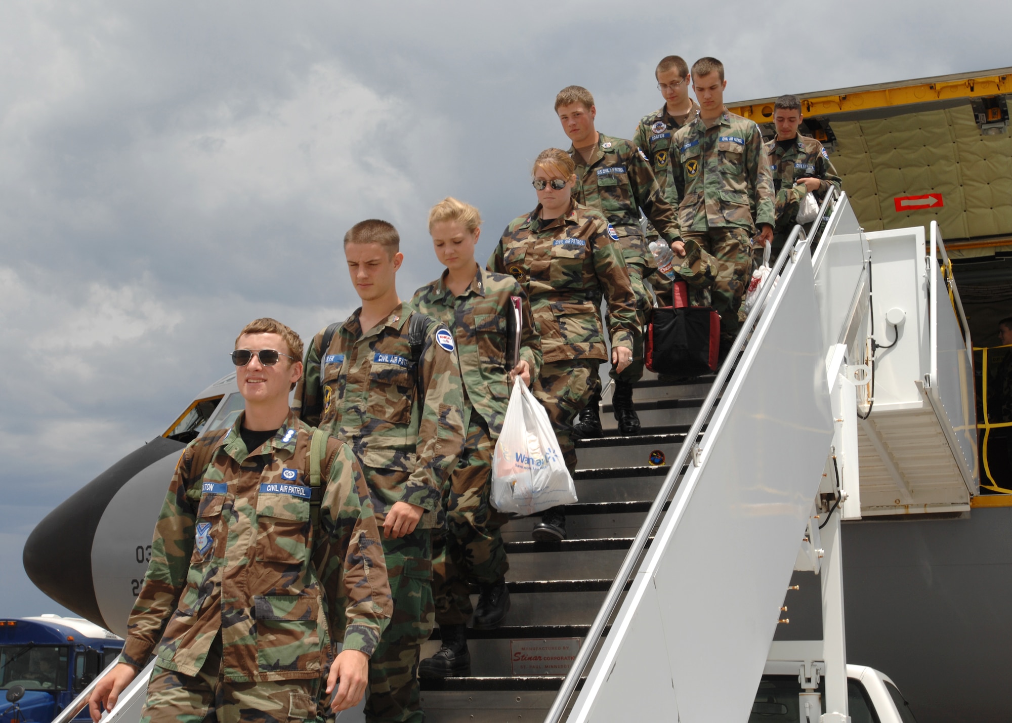 MCCONNELL AIR FORCE BASE, Kan. -- Kansas Wing Civil Air Patrol members from Wichita and Kansas City squadrons, depart from a KC-135 Stratotanker at McConnell AFB, after flying with members of the 349th Air Refueling Squadron on a mission to refuel two German fighter aircraft, July 15. (Photo by Staff Sgt. Jamie Train)