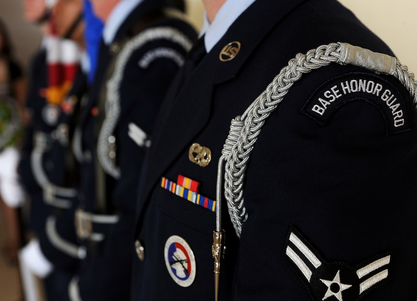 MOODY AIR FORCE BASE, Ga. -- The Moody Air Force Base Honor Guard waits for the start of the 23rd Medical Group change of command ceremony here July 21. Prior to the start of the ceremony, the Honor Guard presents the colors during the playing of the National Anthem. (U.S. Air Force photo by Airman 1st Class Joshua Green)