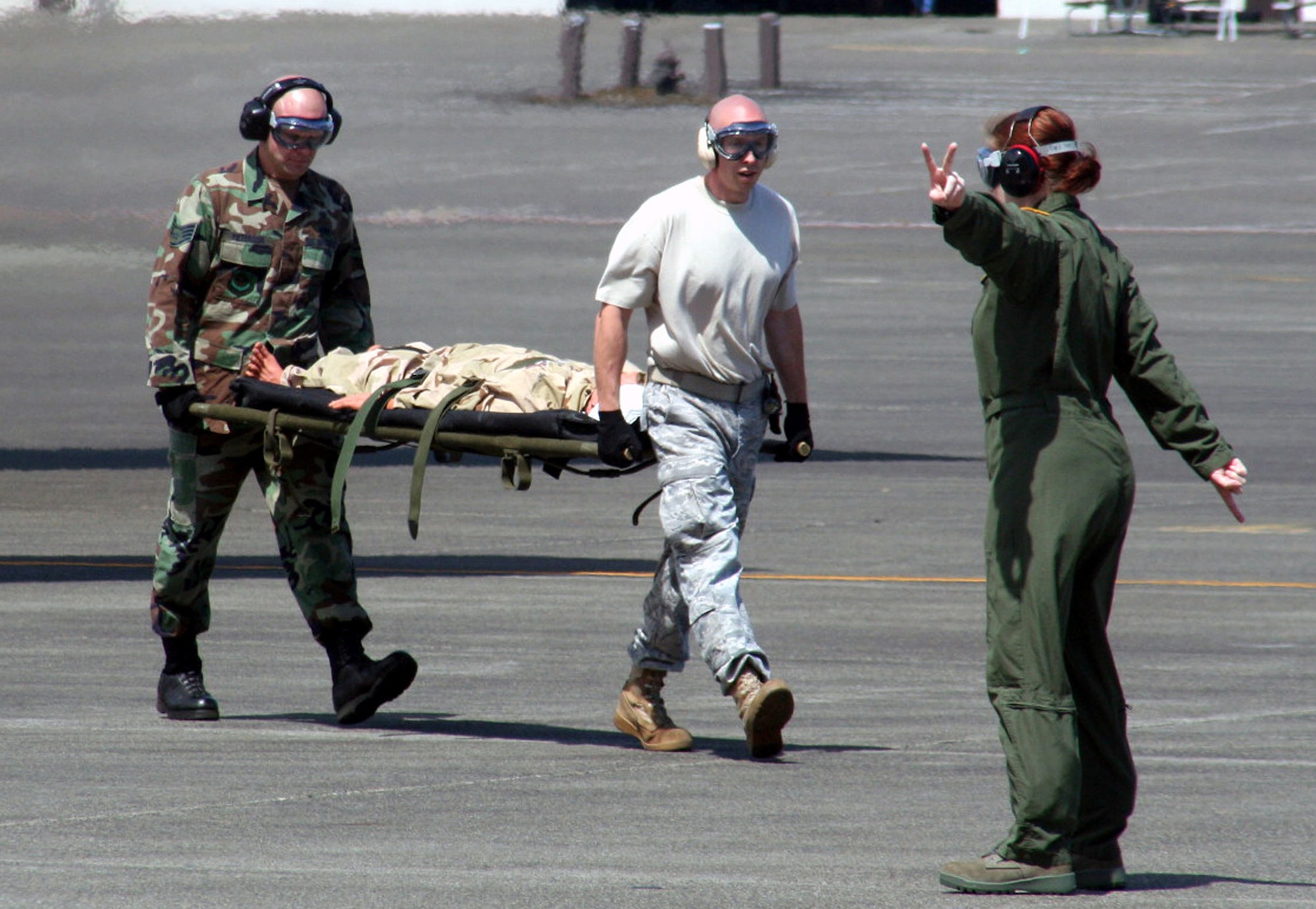 Teams competing in the aeromedical evacuation events for Air Mobility Rodeo 2009 wait in line as the competition commences July 20 at McChord Air Force Base, Wash. More than 100 teams are participating in Rodeo competition, including teams from seven foreign countries. Rodeo is the Air Force's and AMC's premier air mobility competition. It's an international combat skills and flying operations competition designed to develop and improve techniques, procedures and interoperability with international partners to optimize mobility partnerships and enhance mobility operations. (U.S. Air Force Photo/Tech. Sgt. Scott T. Sturkol)