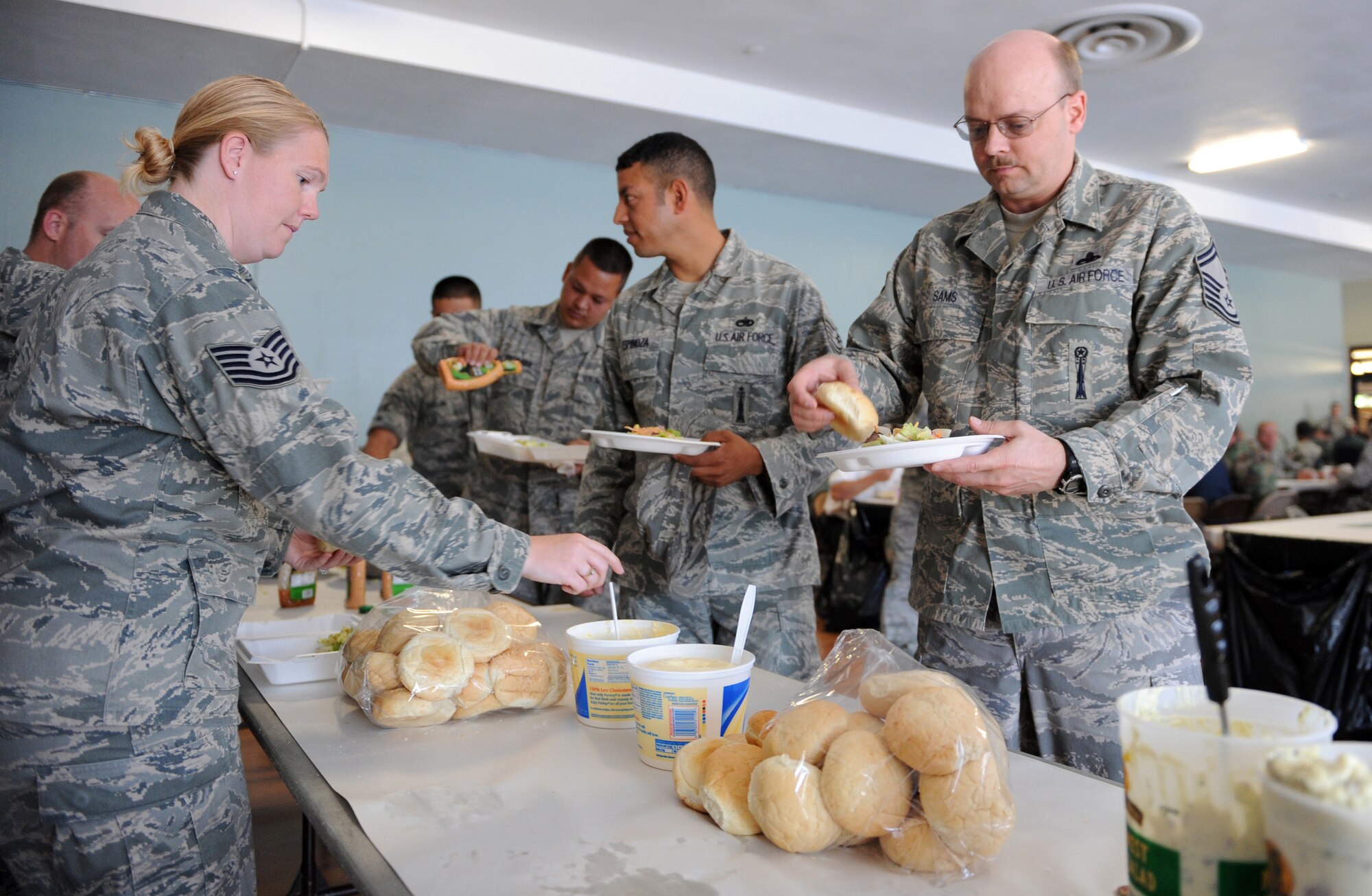 MOUNTAIN HOME AIR FORCE BASE, Idaho -- Gunfighters prepare their plates at the community center during a Chief’s Steak Burn July 16. Money raised from steak burns help offset costs of quarterly and annual awards. The next steak burn is scheduled Aug. 19 at the community center from 11 a.m. to 1 p.m. (U.S. Air Force photo by Airman 1st Class Debbie Lockhart)