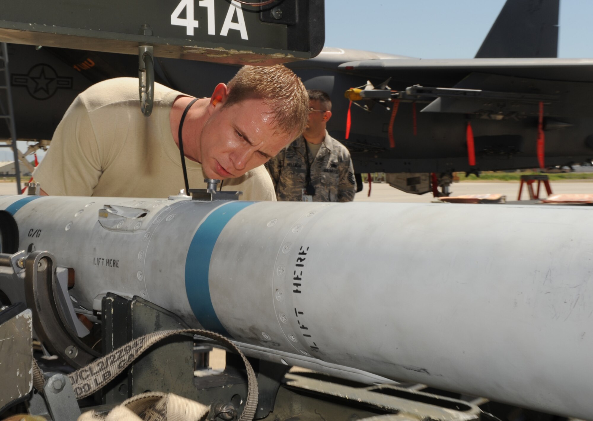 MOUNTAIN HOME AIR FORCE BASE, Idaho-- Staff Sgt. David Foster, 391st Aircraft Maintenance Unit weapons load technician, prepares to unload a missile during a weapons load crew competition July 10. The 390th AMU took first place. (U.S. Air Force photo by Airman 1st Class Renishia Richardson)