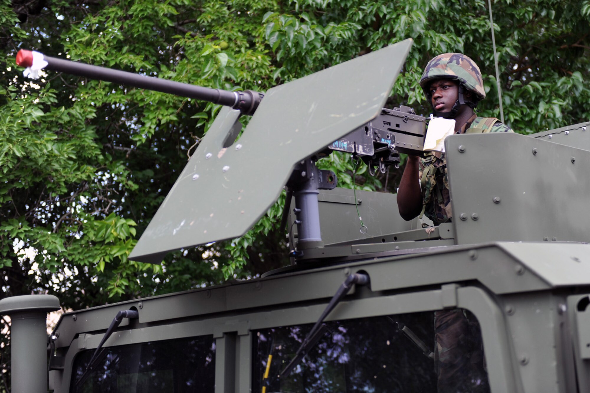 WHITEMAN AIR FORCE BASE, Mo. - Master of Arms 3rd Class Shedrick Sheard focused and ready, provides security overwatch at the entry control point of Camp Arrowhead during the Navy Convoy Training Exercise July 17 - 19. (U.S. Air Force photo/ Senior Airman Jason Huddleston)