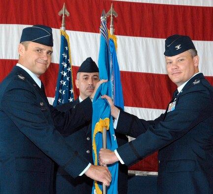 Col. Thomas Gibson, right, accepts command of the 71st Mission Support Group from Col. Chris Nowland, 71st Flying Training Wing commander, during a ceremony held July 17 in Hangar 199 at Vance AFB. Colonel Gibson comes to Vance from the Pentagon. He replaces Col. Jennifer Graham, who retired after 23 years of service. (U.S. Air Force photo/ Terry Wasson)