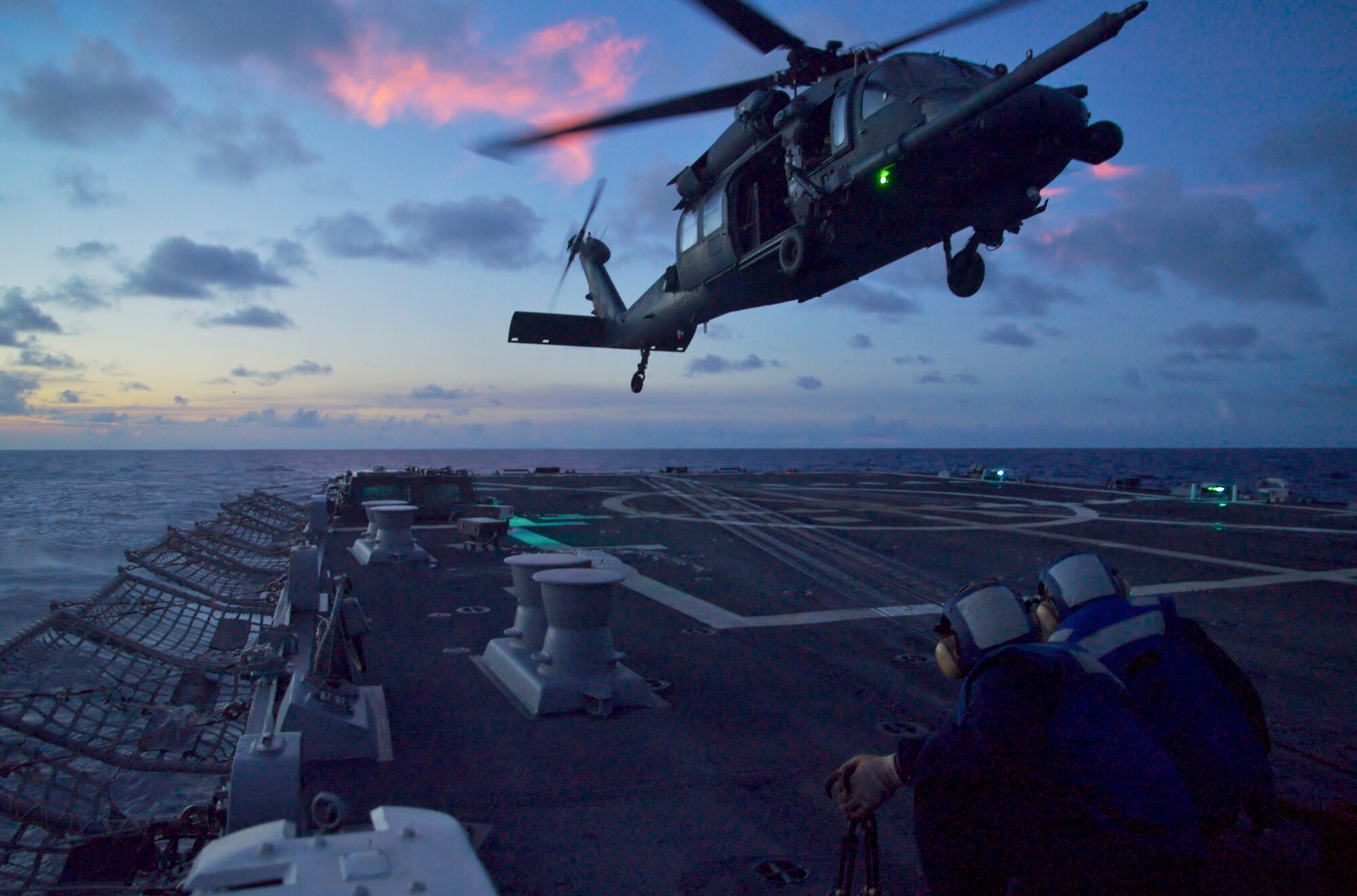 A 33rd Rescue Squadron aircrew on an HH-60G Pave Hawk helicopter from Kadena Air Base, Japan, took part in a refueling operation exercise with the Navy on the USS John S. McCain practicing take off and landing from the vessel's flight deck while the ship was underway March 4 off the coast of Japan. (Courtesy photo) 