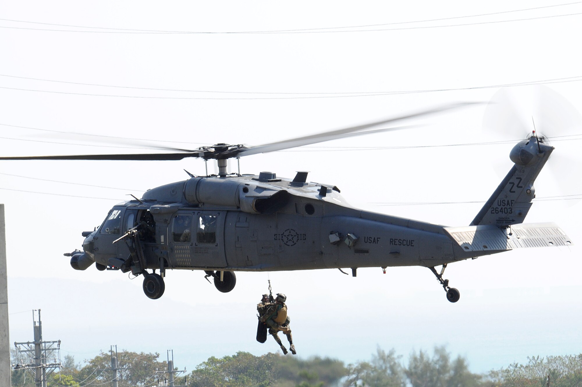 Pararescuemen assigned to 31st Rescue Squadron at Kadena Air Base, Japan, are hoisted into an HH-60G Pave Hawk helicopter during exercise Cope Angel 09-1 in Japan. (U.S. Air Force photo/Staff Sgt Chrissy Best)