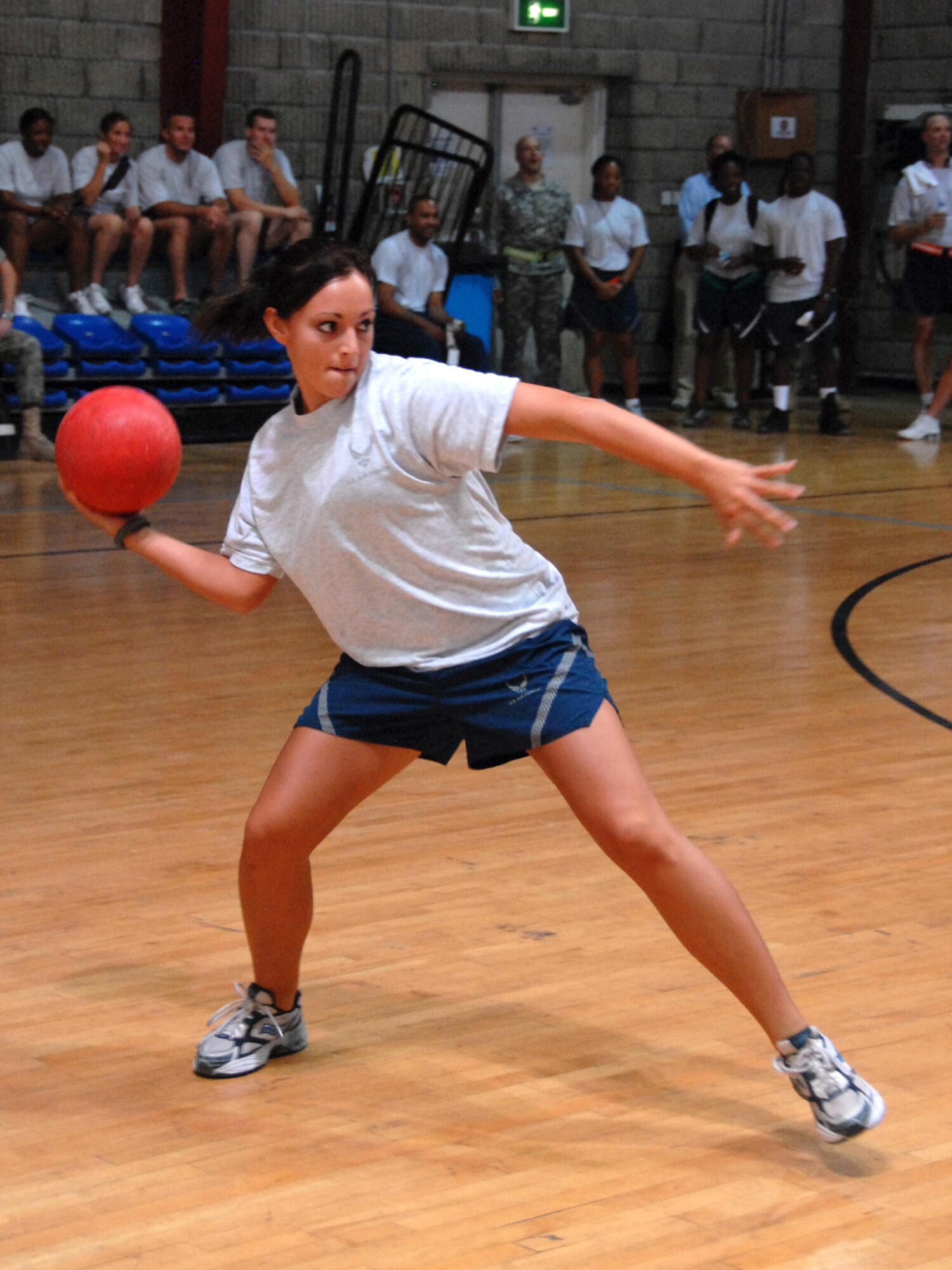 Airman 1st Class Apryl Sanders, 7th Expeditionary Airborne Command and Control Squadron air operations technician, prepares to strike out her opponent in a dodgeball match as part of the Commander’s Cup Tournament, here, July 21. Airman Sanders, a native of Germany, is deployed from Robins Air Force Base, Ga., in support of Operations Iraqi Freedom and Enduring Freedom. (U.S. Air Force Photo/Tech. Sgt. Jason W. Edwards)