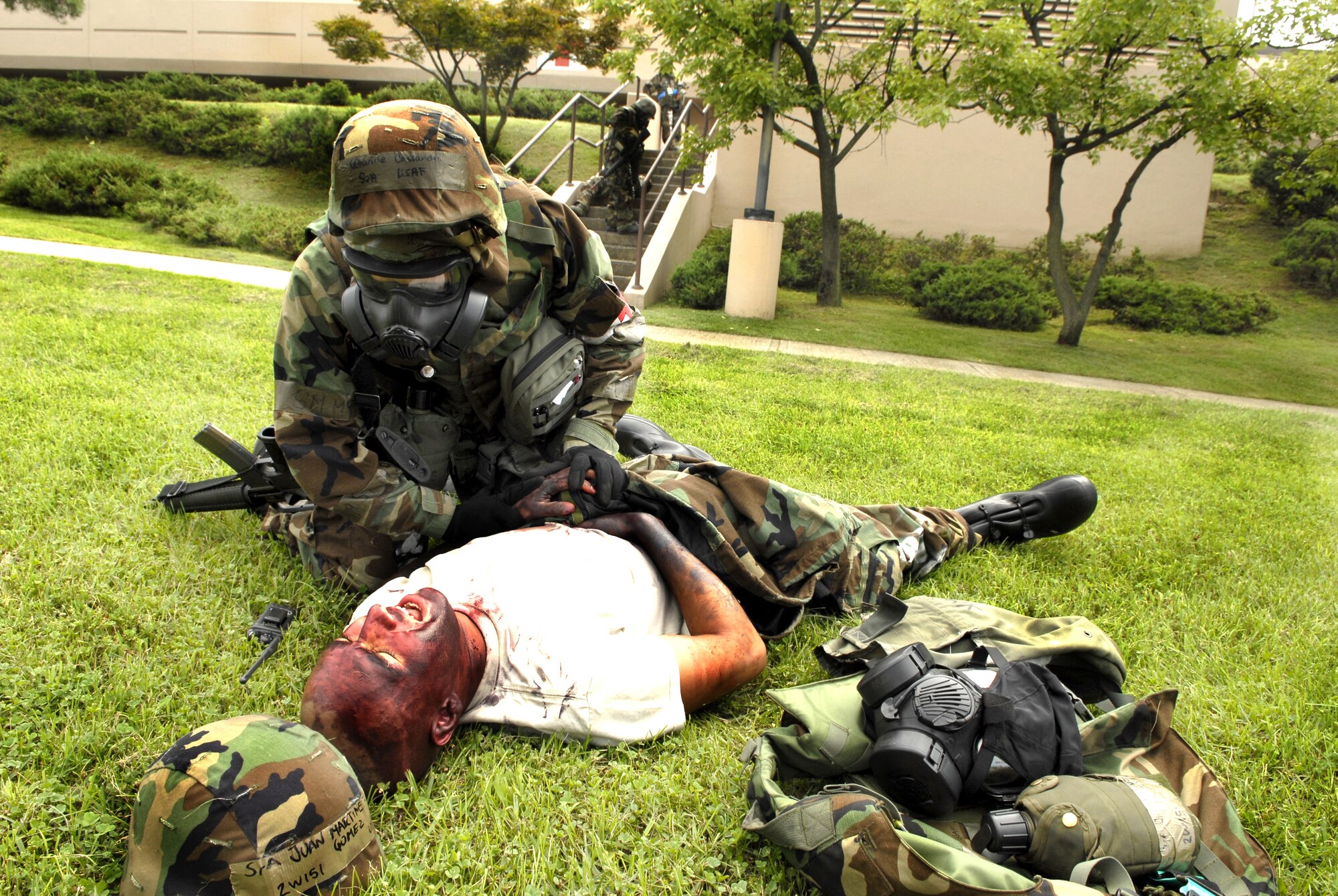 51st Fighter Wing hospital staff respond to a mass casualty outside the hospital after a simulated missile attack during exercise Beverly Bulldog 09-03 on Osan Air Force Base, Republic of Korea, July 21. (U.S. Air Force photo/Senior Airman Stephenie Wade)