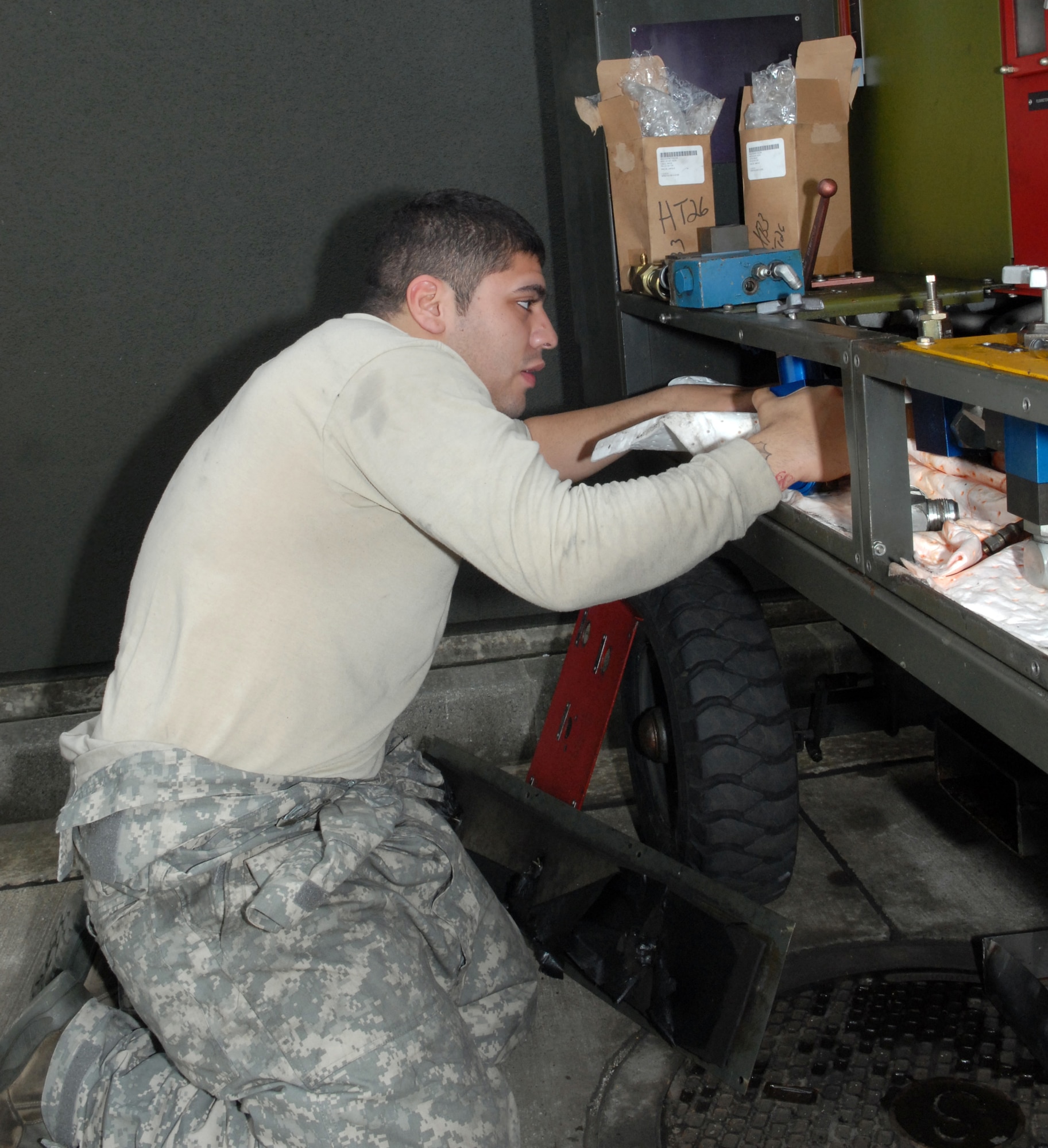 MISAWA AIR BASE, Japan -- Airman 1st Class Chris Valladolid, 35th Maintenance Squadron Aerospace Ground Equipment journeyman, rebuilds valves for a hydraulic test stand July 23 in the AGE maintenance building. Periodic cleaning and preventative maintenance of flightline equipment ensures proper operation. (Air Force photo/Staff Sgt. Phillip Butterfield)
