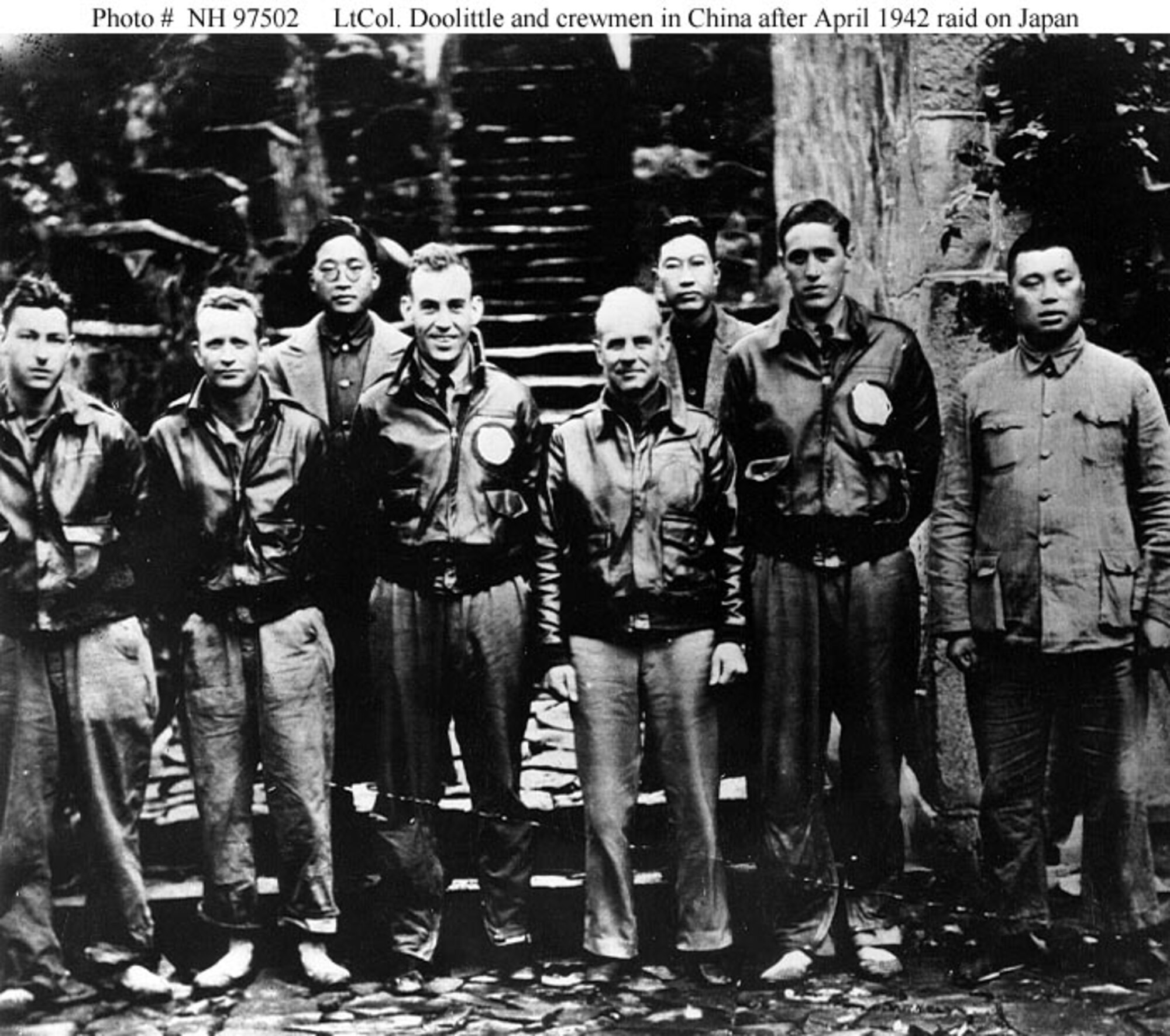 Lt. Col. James H. Doolittle, U.S. Army Air Corps, (center) with members of his flight crew and Chinese officials in China after the April 18, 1942 attack on Japan. Those present are (from left to right): Staff Sgt. Fred A. Braemer, bombardier; Staff Sgt. Paul J. Leonard, flight engineer/gunner; General Ho, director of the Branch Government of Western Chekiang Province; Lt. Col. Richard E. Cole, co-pilot; Lt. Col. Doolittle, pilot and mission commander; Henry H. Shen, bank manager; Lt. Henry A. Potter, navigator; Chao Foo Ki, secretary of the Western Chekiang Province Branch Government. (Official U.S. Army Air Forces Photograph, from the collections of the Naval Historical Center)