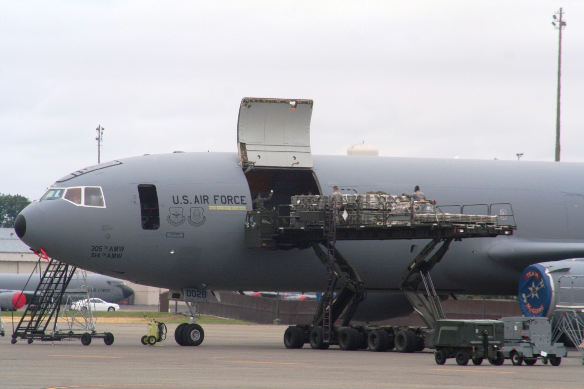 Airmen load cargo into a KC-10 Extender from McGuire Air Force Base, N.J., during operations for Air Mobility RODEO 2009 July 23 at McChord AFB, Wash.  (U.S. Air Force Photo/Tech. Sgt. Scott T. Sturkol)