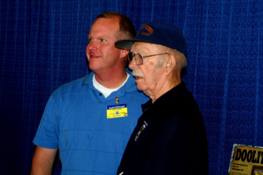 Retired Lt. Col. Ed Saylor, veteran of the Doolittle Raid of April 18, 1942, over Tokyo, Japan, stops for a photo with a participant in Air Mobility RODEO 2009 July 23 at McChord Air Force Base, Wash.  (U.S. Air Force Photo/Tech. Sgt. Scott T. Sturkol)