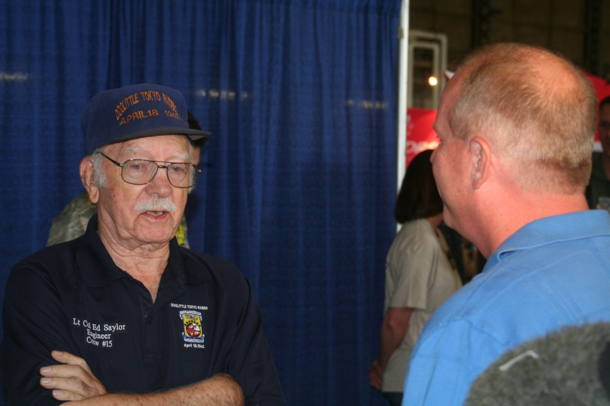 Retired Lt. Col. Ed Saylor, veteran of the Doolittle Raid of April 18, 1942, over Tokyo, Japan, talks with a participant in Air Mobility RODEO 2009 July 23 at McChord Air Force Base, Wash.  (U.S. Air Force Photo/Tech. Sgt. Scott T. Sturkol)