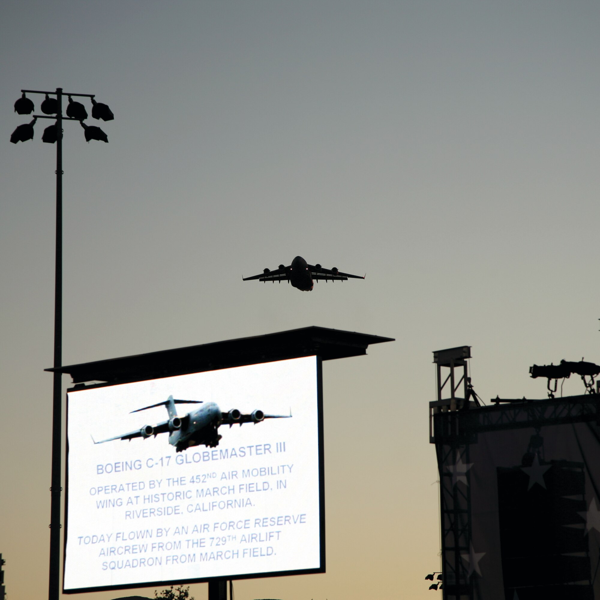 A C-17 from the 729th Airlift Squadron at March ARB dips to 1,000 feet to fly over the City of Corona’s “July 4 Celebration” at Santana Park. The flyover was the last in a continuous series of 10 flyovers that day. (Photo courtesy of the City of Corona)