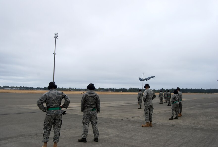 MCCHORD AIR FORCE BASE, Wash. – McGuire Air Force Base, N.J., maintainers pause for a minute to see their KC-10 perform an airshow takeoff. The maintenance crew was here to compete in Air Mobility RODEO 2009. (U.S. Air Force photo/Airman 1st Class Amber Kelly-Herard)
