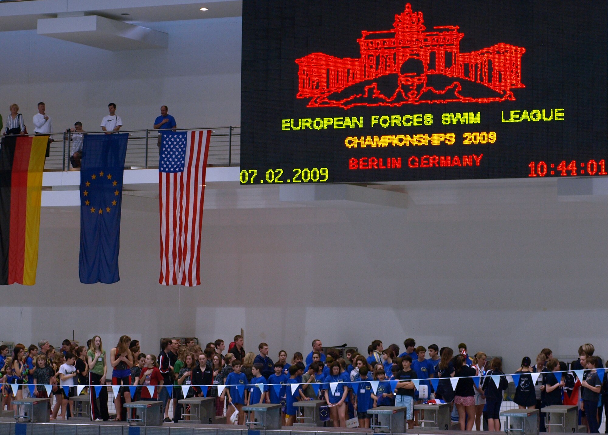 Swimmers, coaches, families and friends alike take part in the opening ceremony for the 2009 European Forces Swim League Championships in Berlin Feb. 7.  The Aviano Sea Dragons Swim Team had 12 swimmers compete at the championships.  (Courtesy photo)