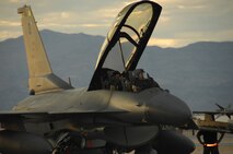NELLIS AIR FORCE BASE, Nev. -- A 79th Fighter Squadron F-16 is prepared for a Green Flag night mission. The F-16 D-model has a front and back seat to allow an instructor or observer to ride. In this case, 1st Lt. Carolyn Winn, 79th FS director of intelligence, is in the back seat for a first-hand look at what pilots encounter at Green Flag. (U.S. Air Force photo/2nd Lt. Emily Chilson)