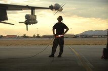 NELLIS AIR FORCE BASE, Nev. -- Senior Airman Bryan Timmons, 79th Aircraft Maintenance Unit crew chief, prepares to launch an F-16CJ Fighting Falcon during a Green Flag exercise. Green Flag facilitates the close air support function of air-to-ground attack, and trains units prior to their deployments. (U.S. Air Force photo/2nd Lt. Emily Chilson)