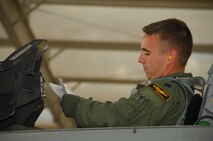 NELLIS AIR FORCE BASE, Nev. -- Captain Geff Gebhardt, 79th Fighter Squadron "Tigers" pilot, conducts pre-flight checks before a Green Flag mission. Green Flag exercises prepare units for deployment. The 79th FS from Shaw Air Force Base, S.C., is scheduled to deploy to Afghanistan in October. (U.S. Air Force photo/2nd Lt. Emily Chilson)