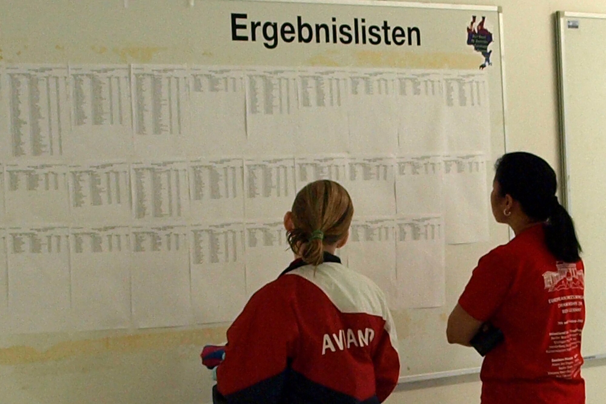 An Aviano Sea Dragons Swim Team member checks out the results of various heats during the 2009 European Forces Swim League Championships held Feb. 7 in Berlin.  The ASD team had 12 swimmers compete at the championships.  (Courtesy photo)