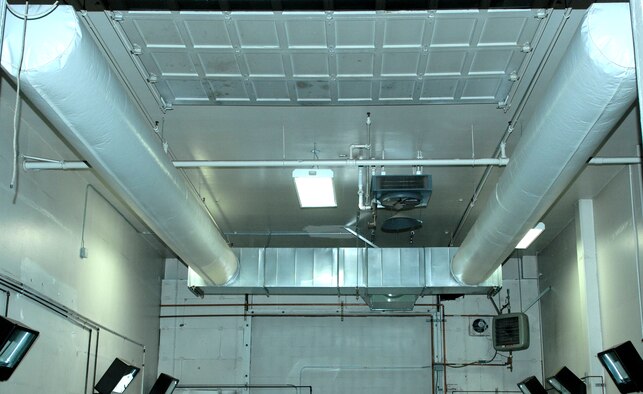 ELMENDORF AIR FORCE BASE, Alaska -- In November 2008, Elmendorf was the location for Alaska and Pacific Air Forces to install solar walls. Two of these walls hang on the outside of the 3rd Logistics Readiness Squadron, so far they have saved Elmendorf $15,000 in energy cost. Once the air heats through the outside walls it is brought in through these air ducts (U.S. Air Force photo/Airman 1st Class Christopher Gross) 