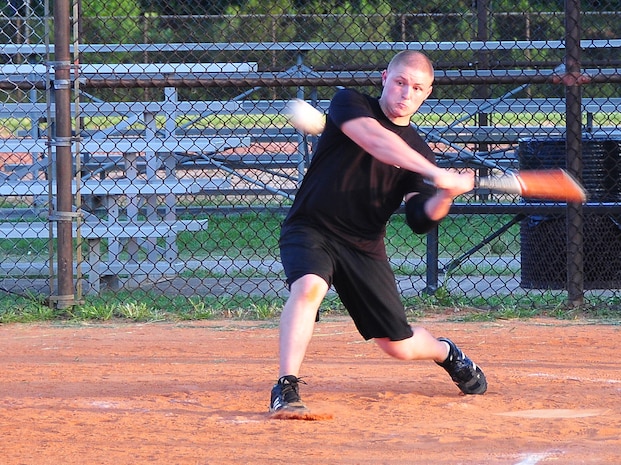 Ethan Kleckler takes a swing during an intramural softball game here July 21. The game was held between the 437th Aircraft Maintenance Squadron's Team 1 and the 437th Logistics Readiness Squadron. Kleckler is with the 437 LRS. (U.S. Air Force photo/Staff Sgt. Daniel Bowles) 