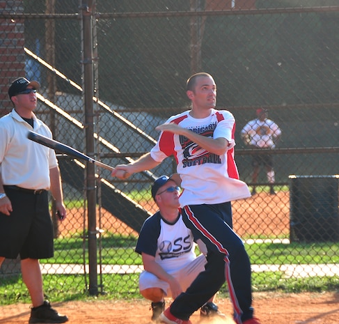 Robby Kindernay prepares to run after hitting a fly ball into the outfield during a shutout intramural softball game here July 21. 437th Security Forces Squadron won against 437th Operations Support Squadron 10-0. Kindernay is with the 437 SFS. (U.S. Air Force photo/Staff Sgt. Daniel Bowles)