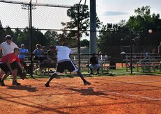 Jamaal Avington keeps his eye on the ball before taking a swing during a close intramural softball game here July 21. Avington is with the 437th Force Support Squadron. (U.S. Air Force photo/Staff Sgt. Daniel Bowles)