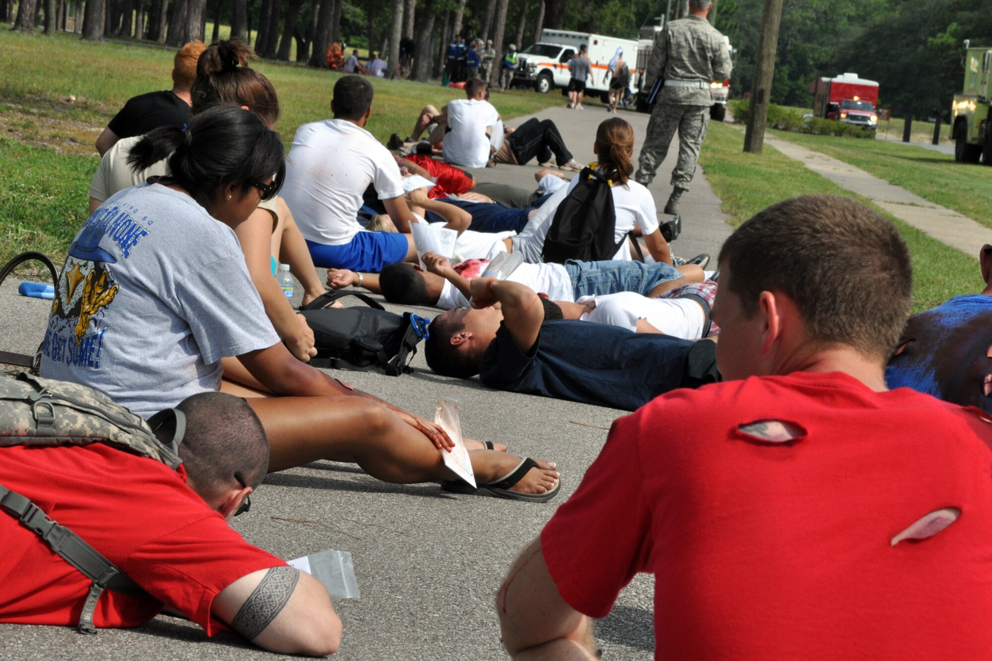 EGLIN AIR FORCE BASE, Fla. – Simulated blast injury victims wait for emergency responders during an exercise here, July 22. The exercise evaluated first responders and medics reaction to real-world crisis scenarios. The simulated explosion injured approximately 40 people and fatally wounded 13. The exercise also evaluated the base’s response to a threat situation with increase Force Protection levels. (U.S. Air Force photo/ Airman Anthony Jennings)