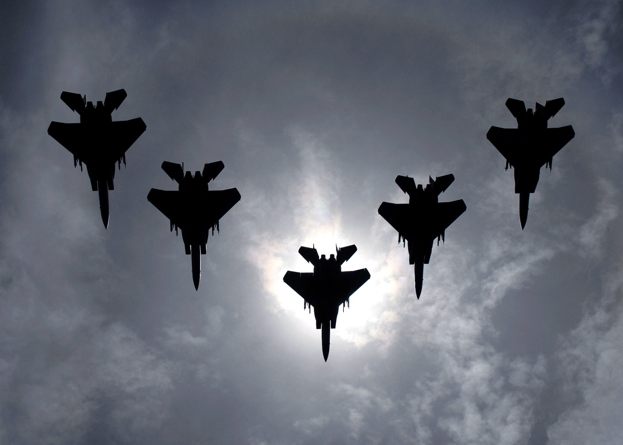 A flight of F-15C Eagles from the 44th Fighter Squadron, Kadena Air Base, Japan, flies during a solar eclipse July 22 over the island of Okinawa. The eclipse was a rare opportunity for servicemembers here to witness this rare event. (U.S. Air Force photo/Airman 1st Class Chad Warren)