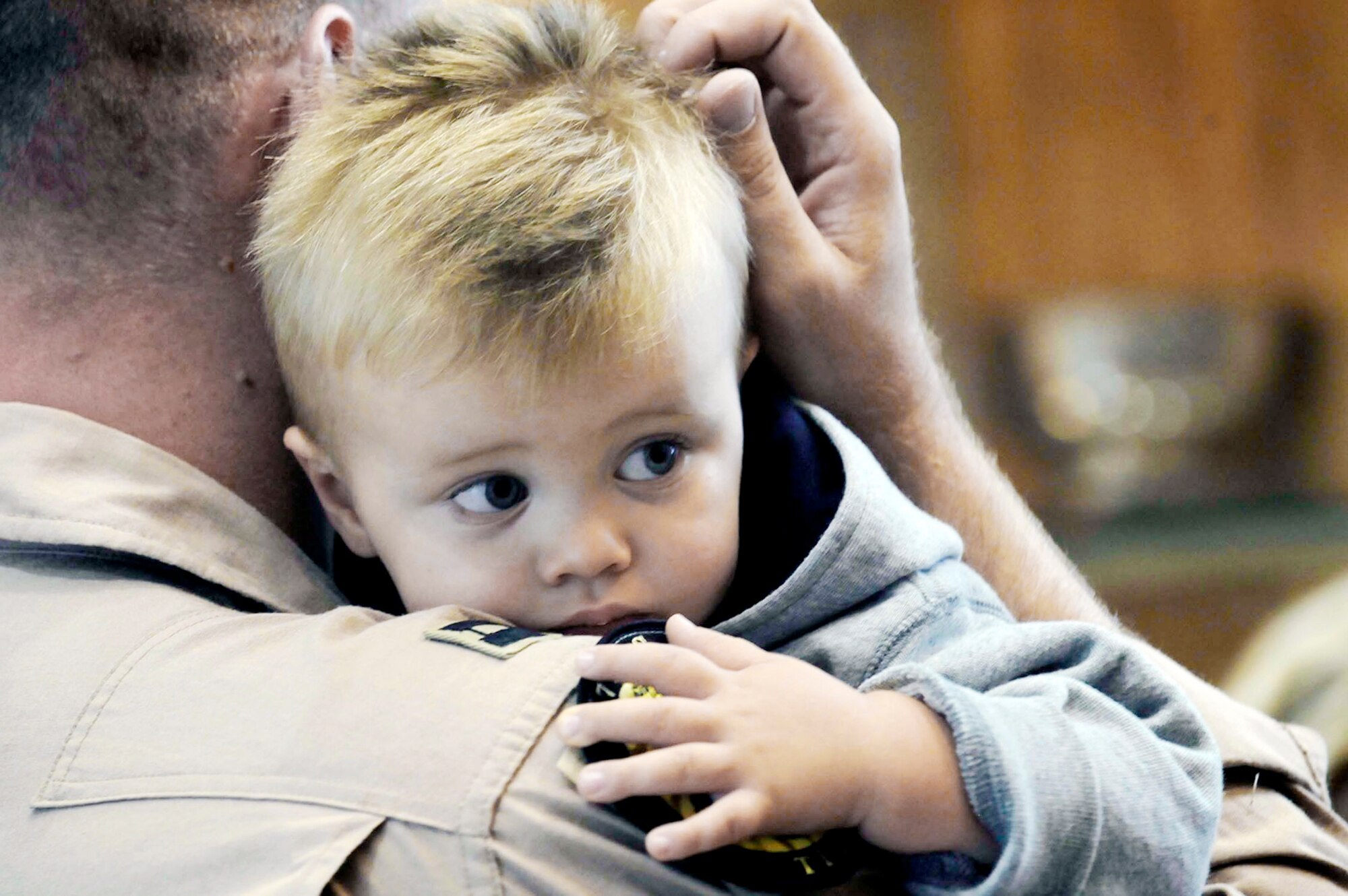 A weapons systems officer assigned to the 37th Bomb Squadron holds his son before deploying July 21 from Ellsworth Air Force Base, S.D. Airmen representing various specialties deployed in support of operations at the 379th Air Expeditionary Wing in Southwest Asia. (U.S. Air Force photo/Airman 1st Class Corey Hook)












