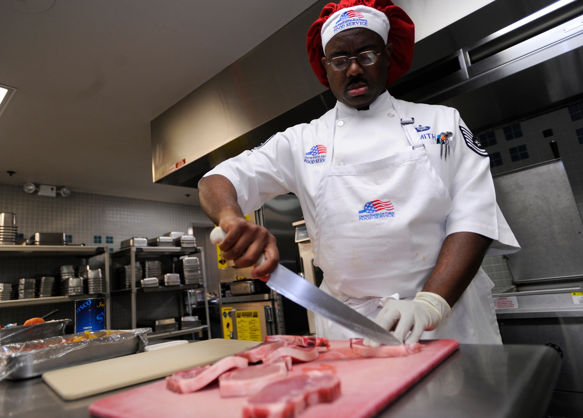 HURLBURT FIELD, FL-- Master Sgt. Barry Smith, 1st Special Operations Force Support Squadron, prepares pork chops during the food services management chef of the quarter competition Jul 21. Each team had one hour and 30 minutes to prepare their meal for the judges. (U.S. Air Force photo/Senior Airman Jason Epley)

