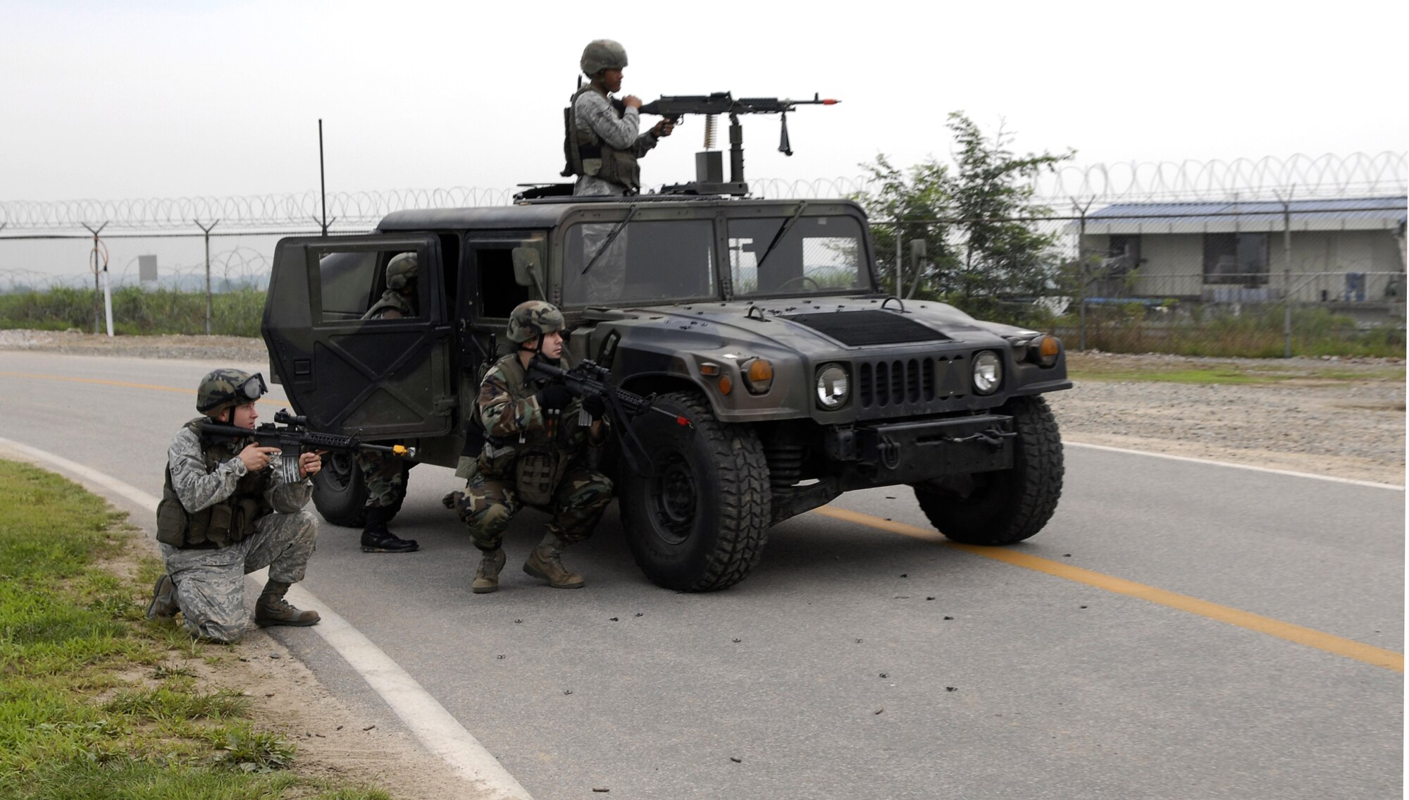51st Security Forces Squadron Airmen guard the base and fight off opposing forces on the flightline during exercise Beverly Bulldog 09-03 at Osan Air Base, Republic of Korea, July 22.  (U.S. Air Force photo/Senior Airman Stephenie Wade)