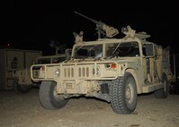 CREECH AIR FORCE BASE, Nev. -- Air Force and Army Special Forces personnel travel in armored vehicles during missions in support of Red Flag 09-4 as well as in deployed locations. Red Flag ground forces begin the mission at Base X, or Air Base Operations Center, on Creech Air Force Base, Nev., and proceed into the Nevada Test and Training Range to conduct close air support scenarios. (U.S. Air Force photo/2nd Lt. Emily Chilson)