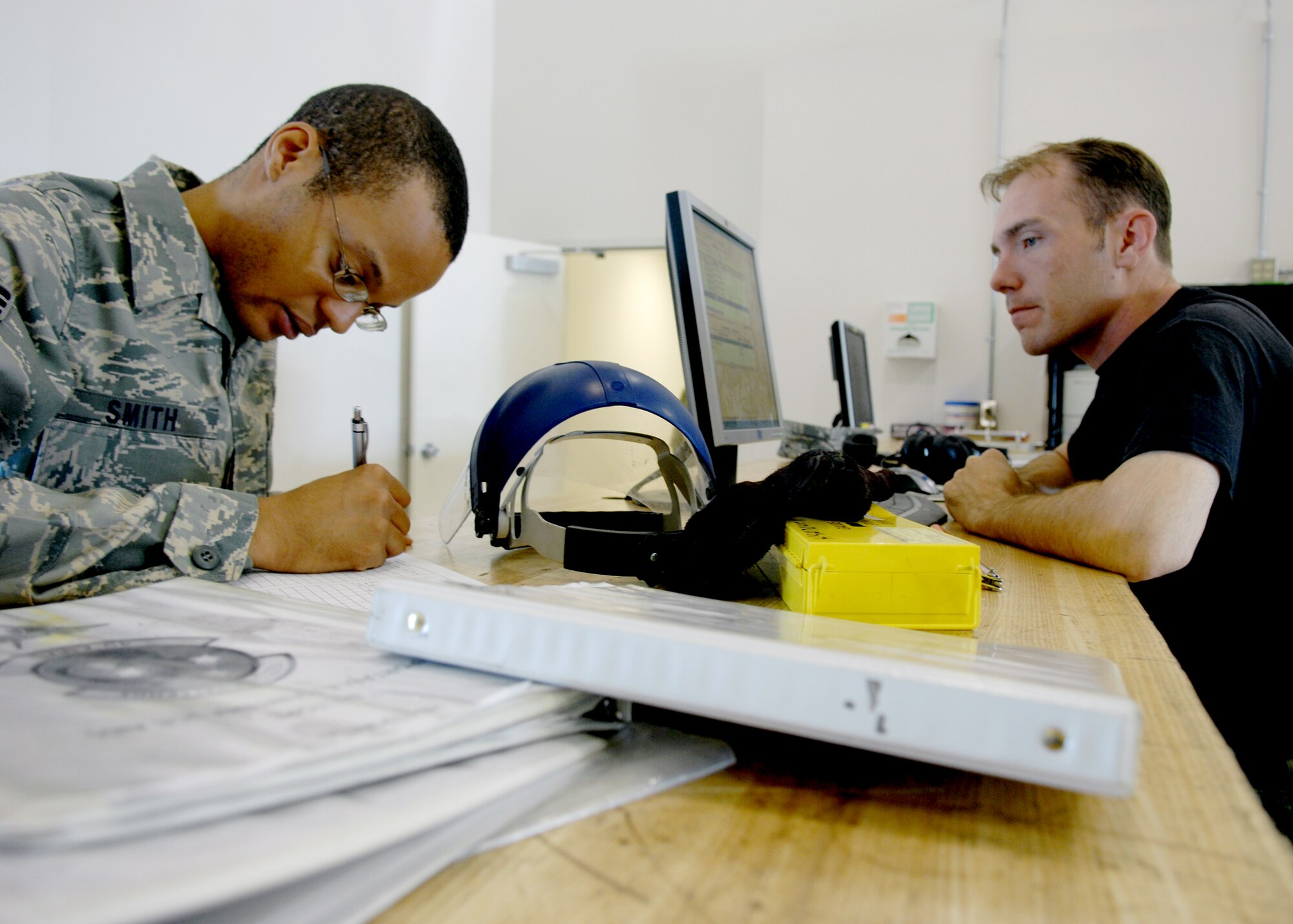 Staff Sgt. Bradley Garrett, 8th Fighter Squadron, issues out maintenance tools to Senior Airman David Smith, a student in the F-22A Raptor Armament Weapons Bay Door System and Suspension Components Maintenance Course, July
15, at Holloman Air Force Base, N.M. 
Students learn how to remove and install weapons equipment, 30 and 90 day prevent maintenance on equipment inspections on aircraft equipment.

 (U.S. Air Force photo/SSgt Anthony Nelson Jr)