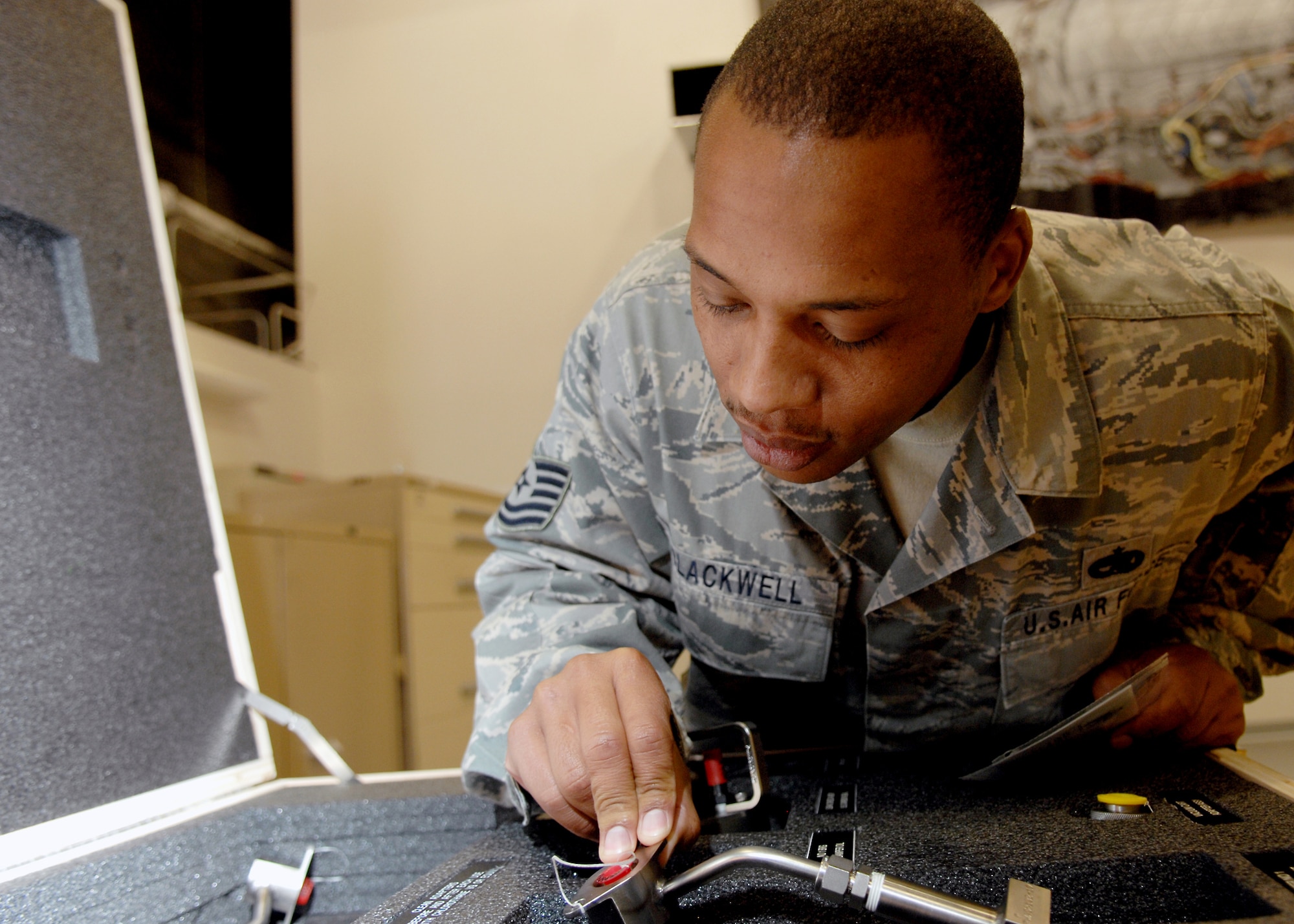 Tech. Sgt. Aaron Blackwell, F-22A Raptor Weapons instructor, performs an inventory check on F-22 engine equipment July 14, at Holloman Air Force Base, N.M. Sgt. Blackwell is assigned to Det. 10, 372nd Training Squadron at Sheppard Air Force Base, Texas.

 (U.S. Air Force photo/SSgt Anthony Nelson Jr)