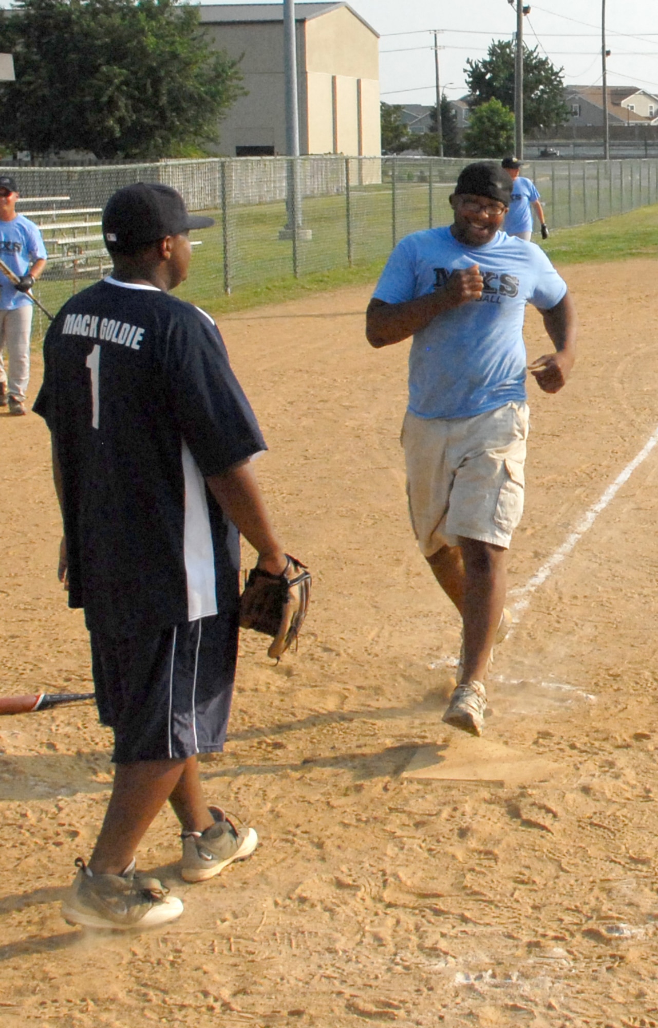 Eric Humbles, 436th Maintenance Squadron first baseman, scores against the 736th Aircraft Maintenance Squadron during an intramural softball game July 16.  736th AMXS defeated 436th MXS 9-5.  (U.S. Air Force Photo/Staff Sgt. Chad Padgett)