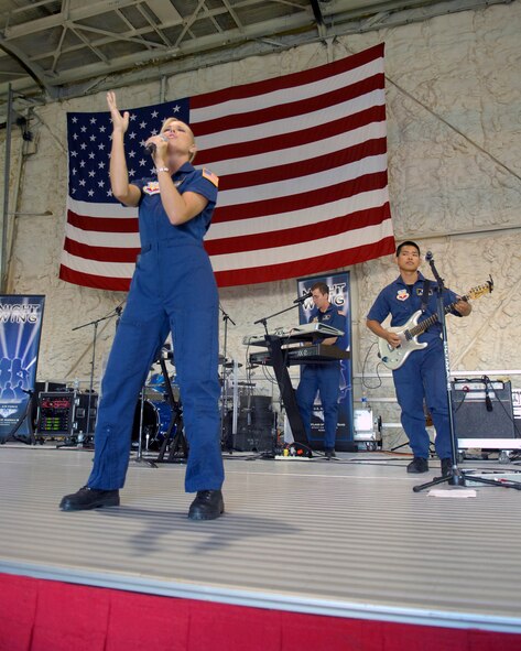 MINOT AIR FORCE BASE, N.D. -- Night Wing, a popular and country music ensemble with the U.S. Air Force Heartland of America Band out of Offutt AFB, Neb., performs during the Northern Neighbors Day festivities here July 18. Thousands of people from the base and local community turned out to watch the 2009 Northern Neighbors Day, which came through on its promise to wow spectators with amazing aerial maneuvers, nail-biting choreography, historic displays and much more. (U.S. Air Force Photo by Airman First Class Jesse Lopez)