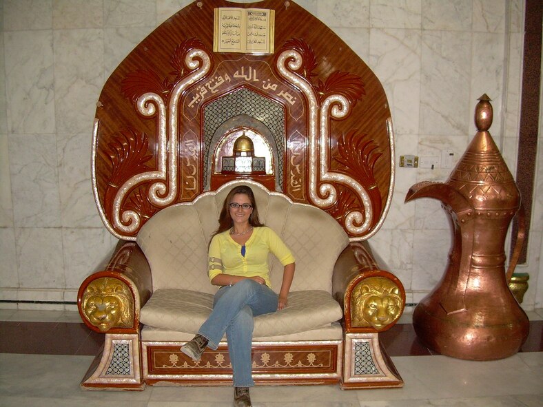 Christie LaPoint, an Aerospace Testing Alliance Emergency Operations Center controller, sits in Saddam Hussein’s throne in a lighter moment during her time in Iraq. (Photo provided)
