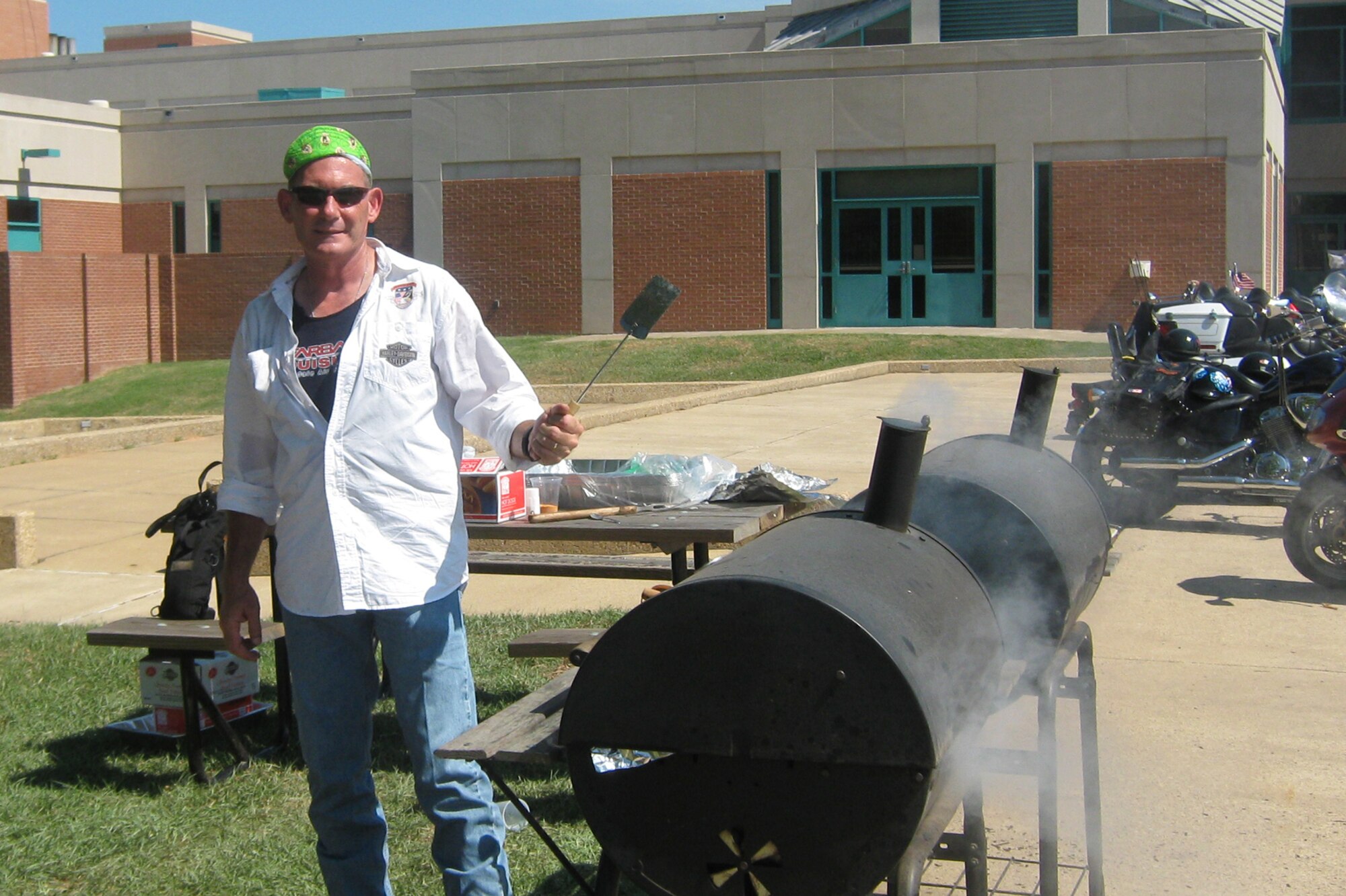 Master Sgt. Rickie Adey Sr., 917th Security Forces Squadron, senior air reserve technician, displays superior cookout etiquette at the Shriners Hospital for Children in Shreveport, La., July 4, 2009. Sergeant Adey, who is a member of the Barksdale Freedom Riders, joined more than 50 other motorcyclists from organizations all over the area in support of the hospital the after it became public that a number of Shriners hospitals may be closed due to budget issues.  Coincidentally, the following week, the Shriners delegates meeting in San Antonio, Texas, July 6, 2009, voted to keep the Shreveport hospital and five others open. Shriners Hospitals have been helping children beat the odds since 1922. The Shreveport hospital was the first in the Shriners Hospital system. (Courtesy photo)  