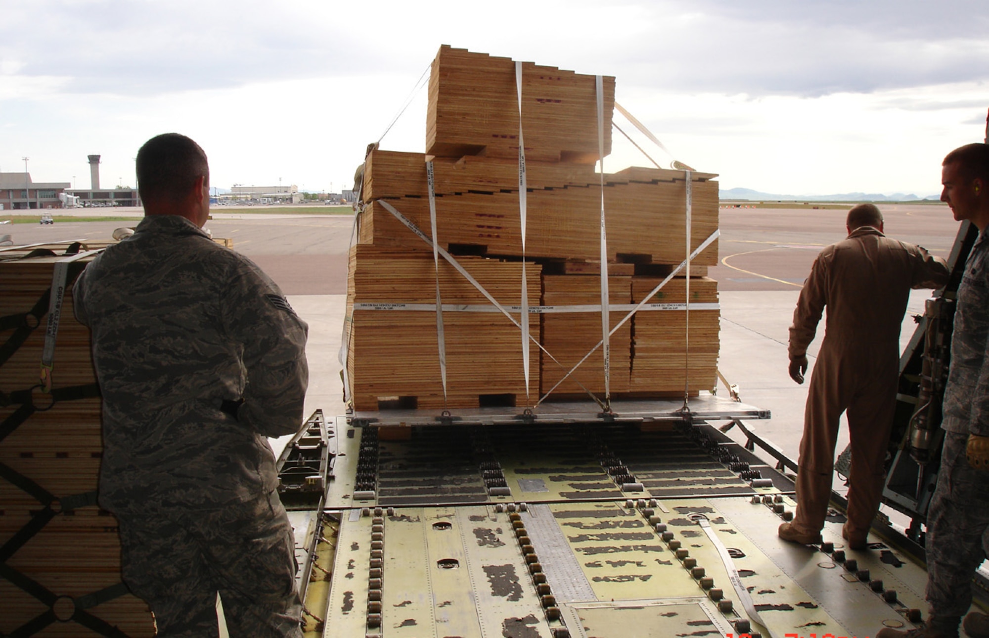 Pallets of shoring material are loaded on to the C-5 at Holman Aviation June 20. The 819th RED HORSE Squadron built the shoring to ensure the two rock crushers could be properly angled and loaded onto the aircraft. (U.S. Air Force photo/Tech. Sgt. John Cottle)