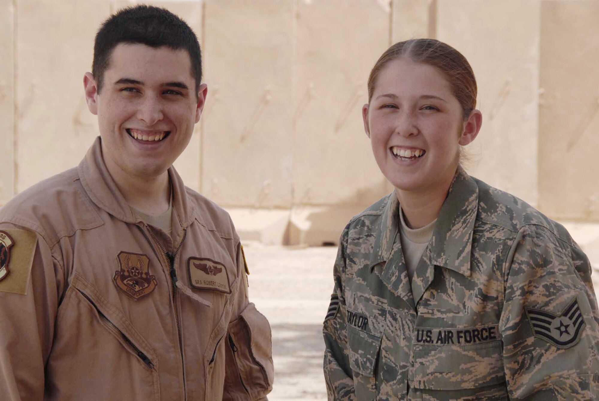 Siblings Senior Airman Robert Laxton and Staff Sgt. Alissa Taylor share a moment at Joint Base Balad, Iraq. Airman Laxton is a 362nd Expeditionary Reconnaissance Squadron cryptologic operator. Sergeant Taylor is a 64th Expeditionary Rescue Squadron aviation resource manager. (U.S. Air Force photo/Senior Airman Nicole Enos)