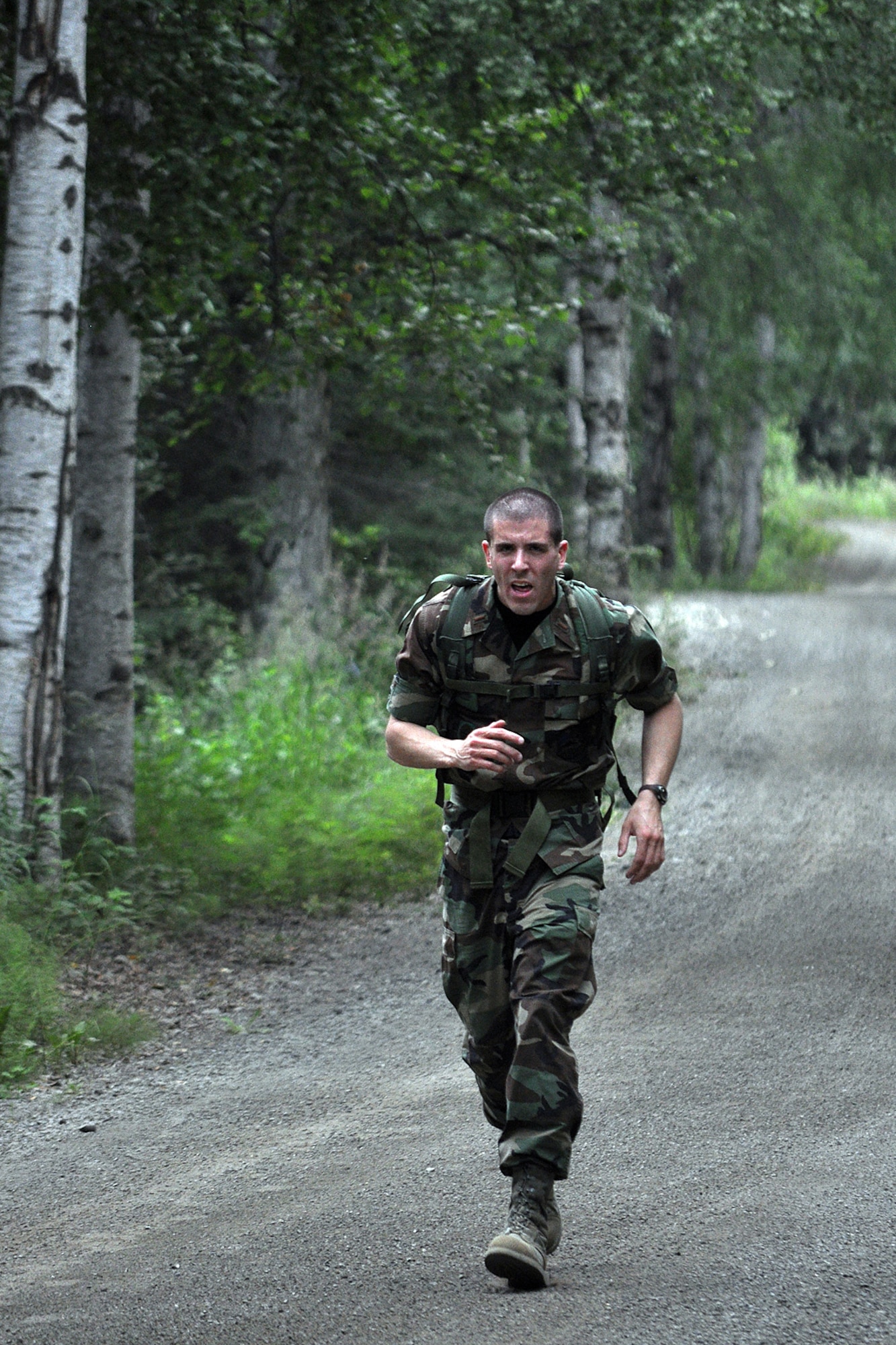 FORT RICHARDSON, Alaska -- 2nd Lt. Chad Herner, 732nd Air Mobility Squadron, heads for the home stretch July 17 in the canoe and run event of the Combat Cross-Country Series. (U.S. Army photo/John Pennell)