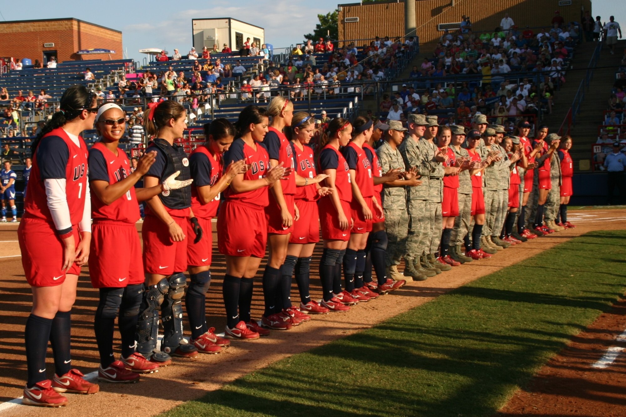 Ten Airmen from the 552nd Air Control Wing were introduced along with the Team USA players as part of Military Appreciation Night at the World Cup of Softball July 17.