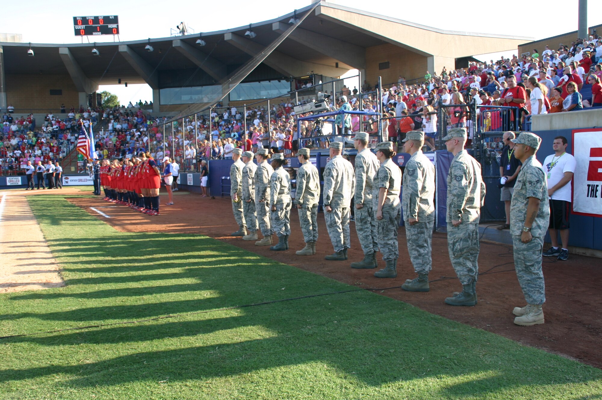 Ten Airmen from the 552nd Air Control Wing were introduced along with the Team USA players as part of Military Appreciation Night at the World Cup of Softball July 17.