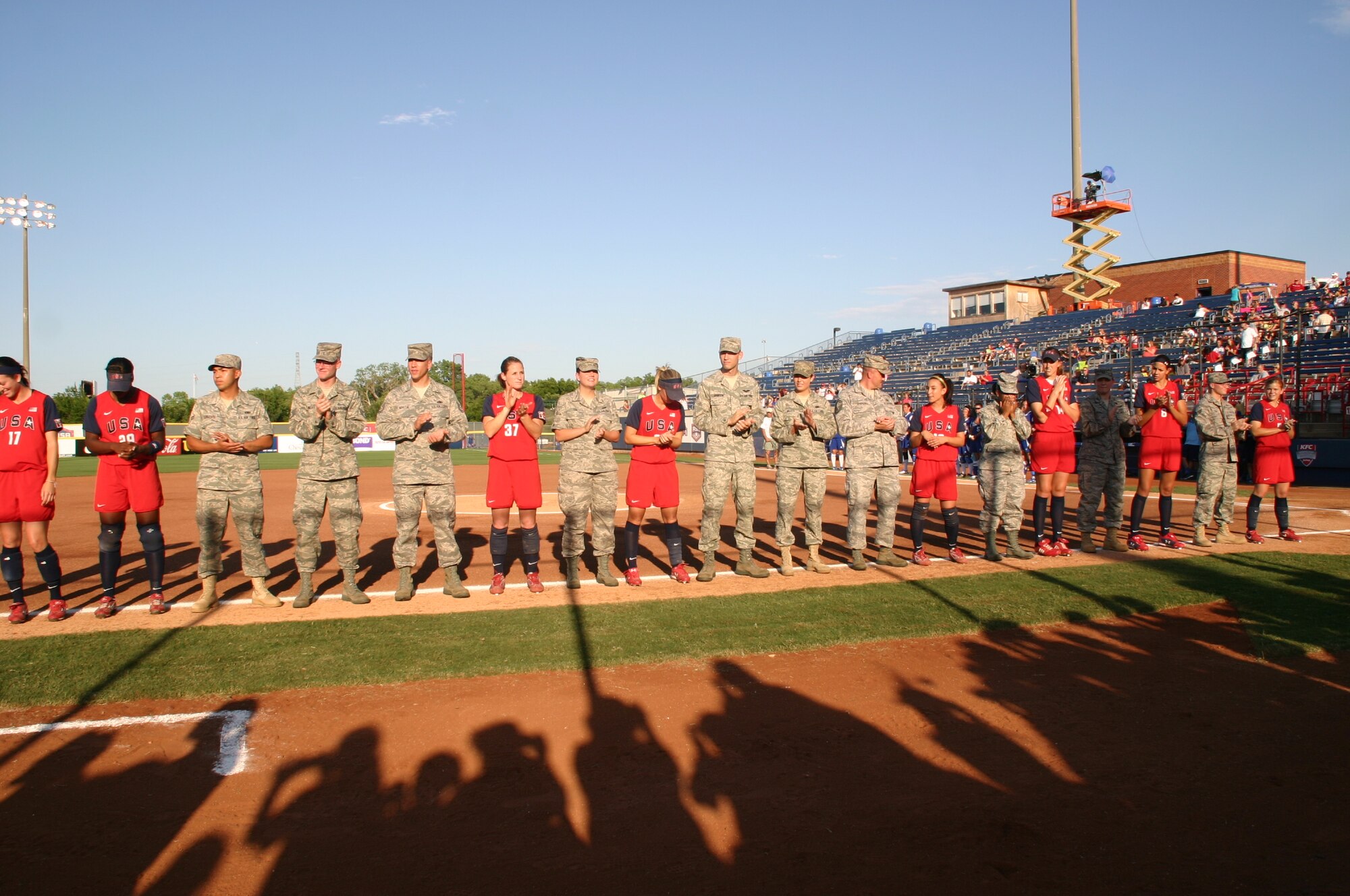 Ten Airmen from the 552nd Air Control Wing were introduced along with the Team USA players as part of Military Appreciation Night at the World Cup of Softball July 17.