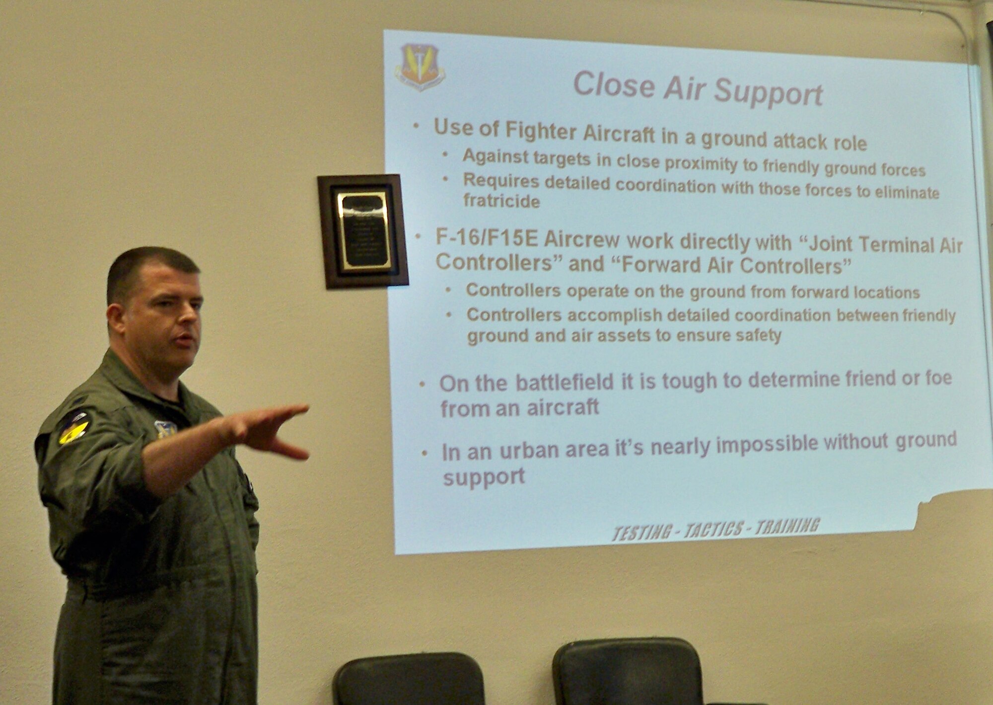 Lt. Col. David Rawlins, 98th Operations Support Squadron commander, briefs Lincoln County commissioners July 20 about the results of recent urban close air support training missions within the county.  The missions, which were flown over Panaca, Calliente and Alamo, Nev. in 2008, allowed A-10, F-15E and F-16 pilots to use Sniper Advanced Targeting Pods to find, fix, and track simulated terrorists in an urban environment.   The 98th Range Wing pre-coordinated the training missions with local officials.  (U.S. Air Force photo by Charles Ramey/released)