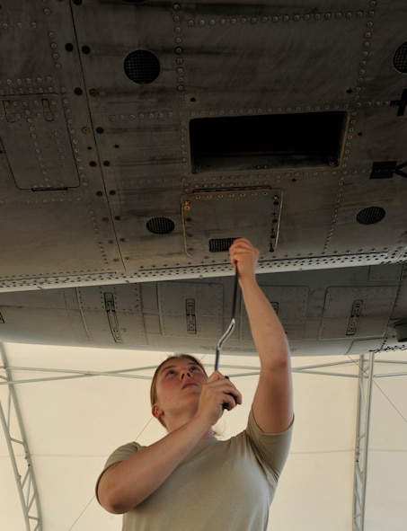 MOODY AIR FORCE BASE, Ga. -- Airman 1st Class Havilah Kornhaber, 23rd Aircraft Maintenance Squadron crew chief, fastens tridairs here July 22. Airman Kornhaber fastened the tridairs to replace old ones and secure a panel on an A-10C Thunderbolt II.  (U.S. Air Force photo by Senior Airman Schelli Jones)